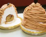 Deux délicieux mont blanc dessert, l'un coupé pour révéler une châtaigne entière au cœur de sa crème onctueuse.